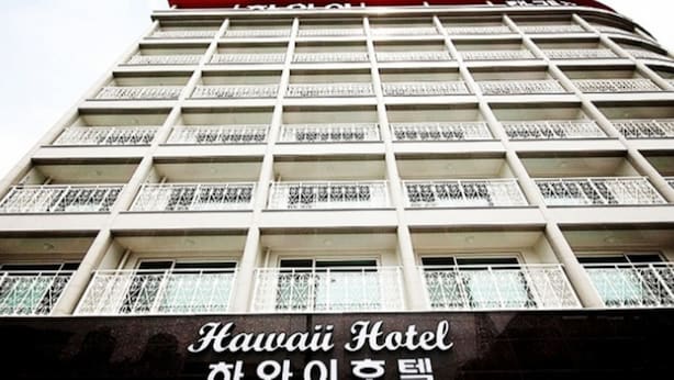 A multi-story hotel building with balconies and a sign reading "Hawai Hotel". - Hawaii Hotel (Tongyeong)