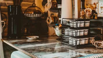 Fridge, microwave, coffee/tea maker, cookware/dishes/utensils