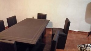 A conference room with a large rectangular table and six black chairs. - El Teotihuacano is 1.5 km away. From the archaeological zone (San Juan Teotihuacan)