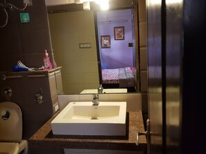 Combined shower/tub, hair dryer, towels, soap
