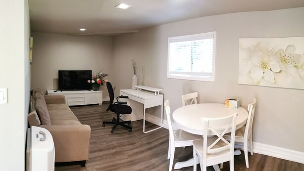 A modern living room with a sofa, TV, desk, and dining table. - Beautiful, Safe, Clean, Spacious 2 bd/1ba in N San Jose 951311 (San Jose)