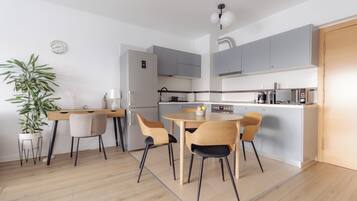 Panoramic Apartment | Private kitchen | Fridge, microwave, oven, stovetop