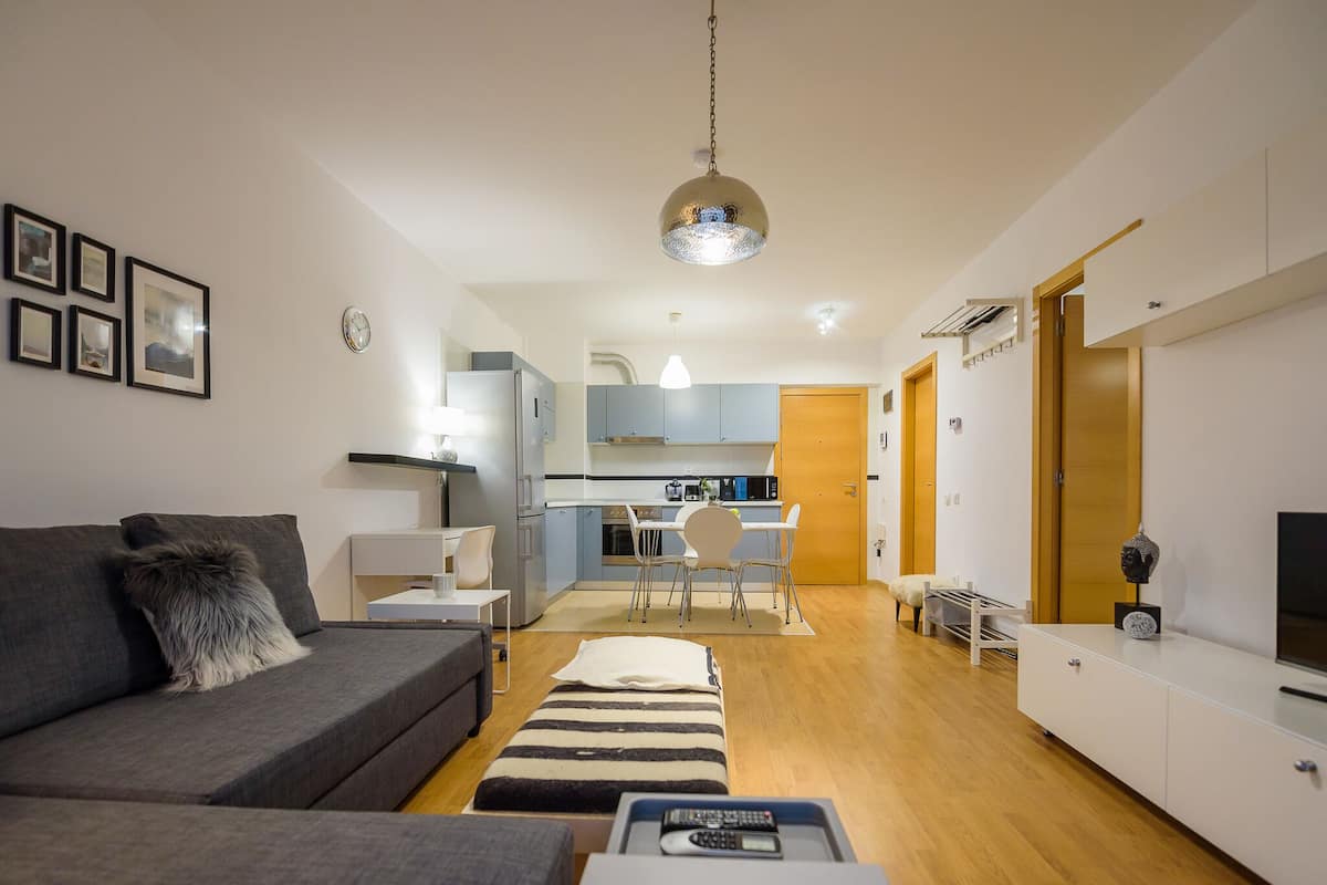 Panoramic Apartment | Living area | 120-cm flat-screen TV with cable channels, TV