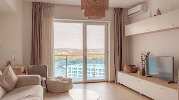 Premier Apartment | Living area | 120-cm flat-screen TV with cable channels, TV