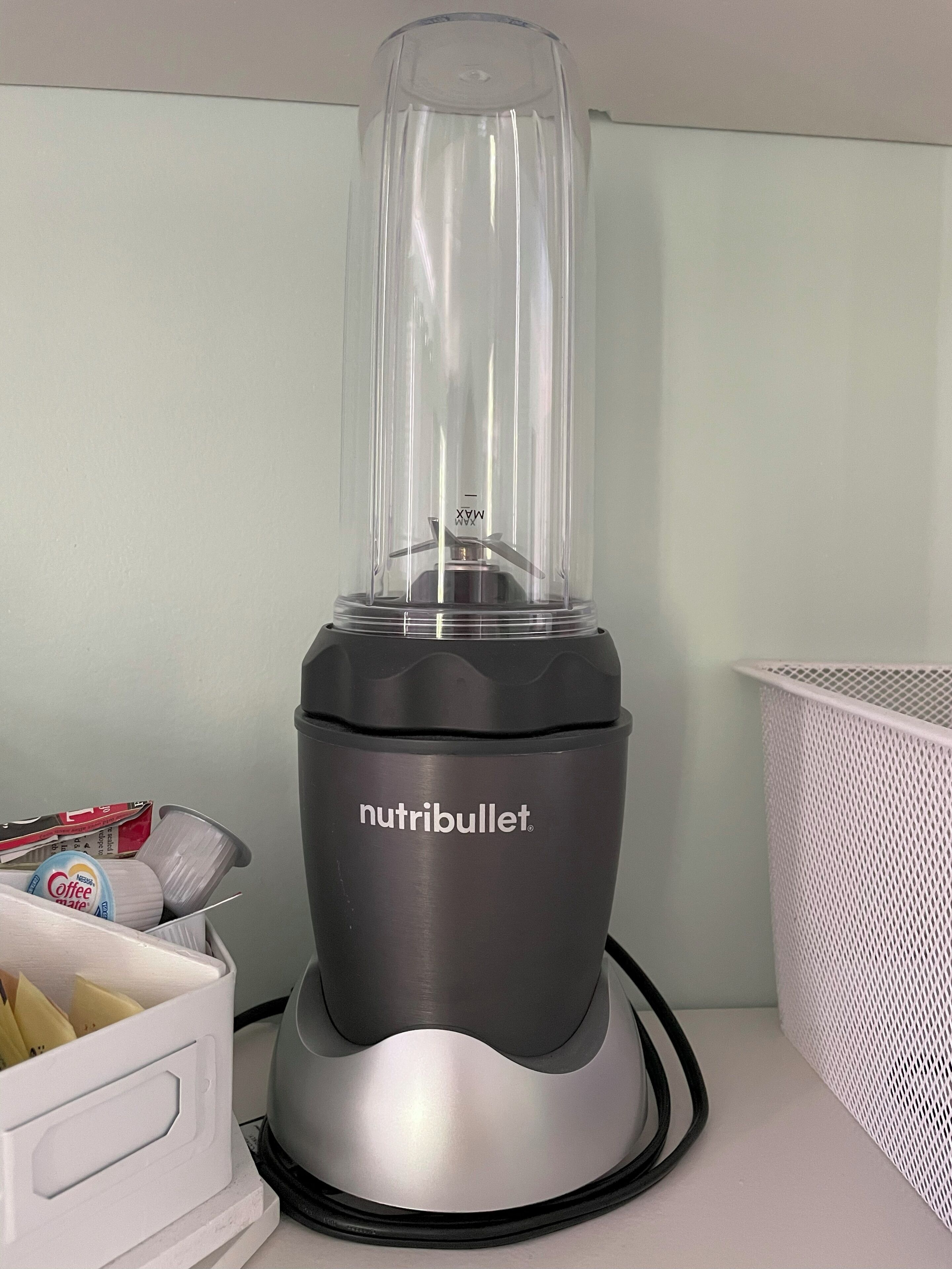 A kitchen with a blender on the counter.