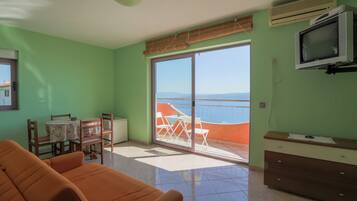 Apartment, 1 Bedroom, Balcony (3) | Living area | Flat-screen TV