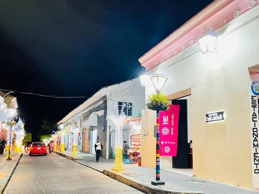 A street with a hotel named "Hotel Solnitza" and a sign for "Public Station".
