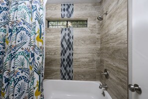 Combined shower/bathtub, hair dryer, towels, soap