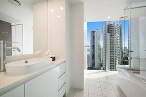 Shower, hair dryer, towels, soap