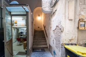 A narrow stairway leading to a landing with a door at the top. - Monteoliveto Modern Flat by Wonderful Italy (Napoli)