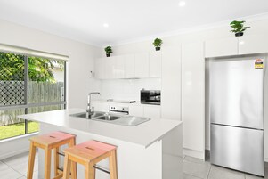 Luxury Villa | Private kitchen | Full-size fridge, microwave, oven, stovetop