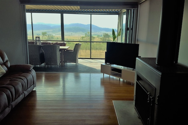 Relax in front of the open indoor wood fireplace on a 4 recliner lounge..