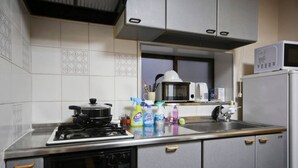 Apartment | Private kitchenette | Fridge, microwave, stovetop, cookware/dishes/utensils - Showamachi 1 Chome (Tokyo)