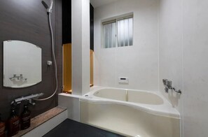Bathtub, hair dryer, towels, soap