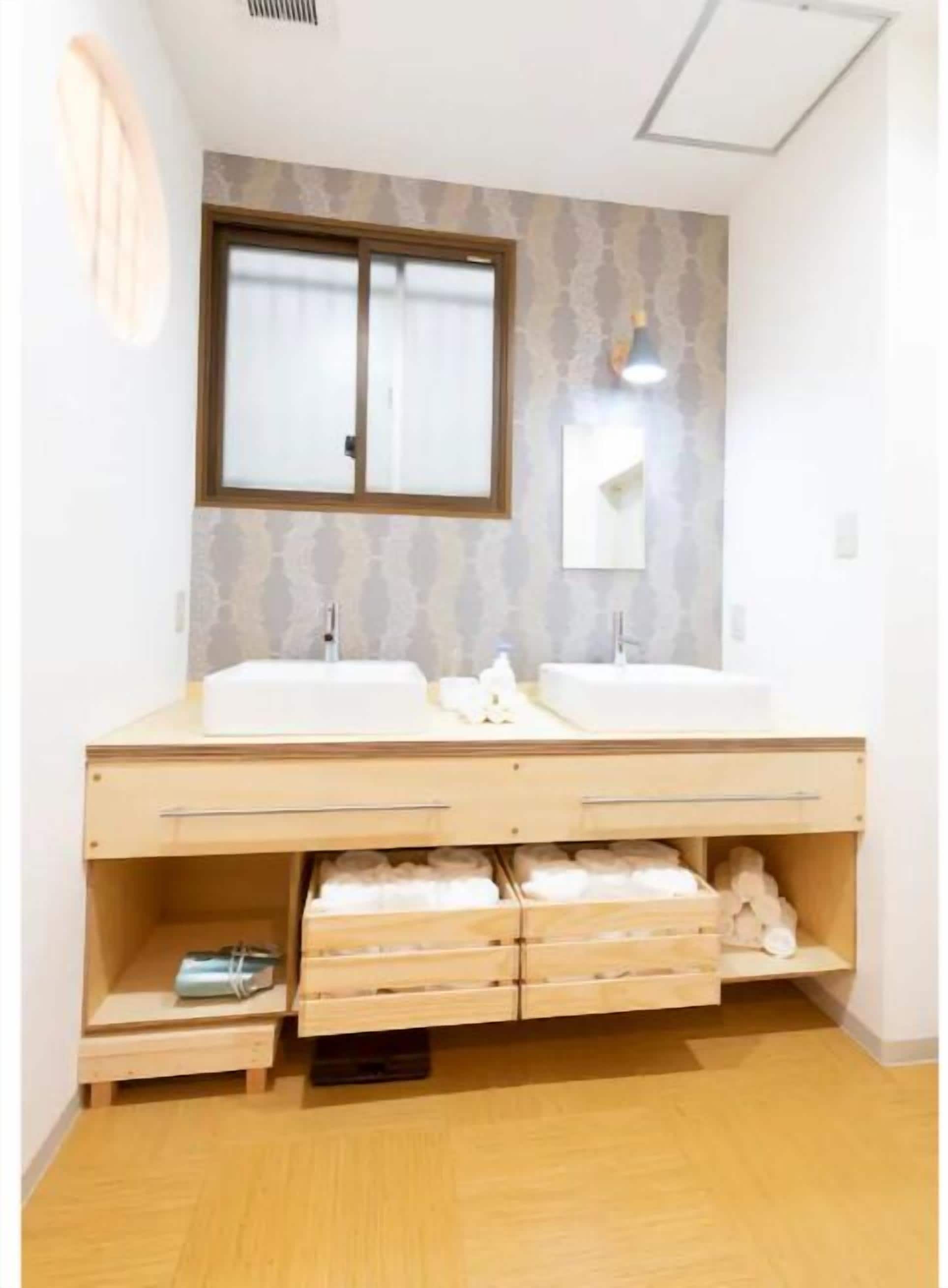 Bathtub, hair dryer, towels, soap