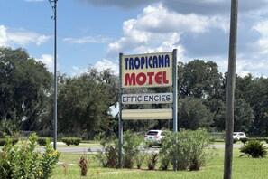 A Tropicana Motel sign with a name and a subheading. - Tropicana Motel Wauchula FL (Wauchula)