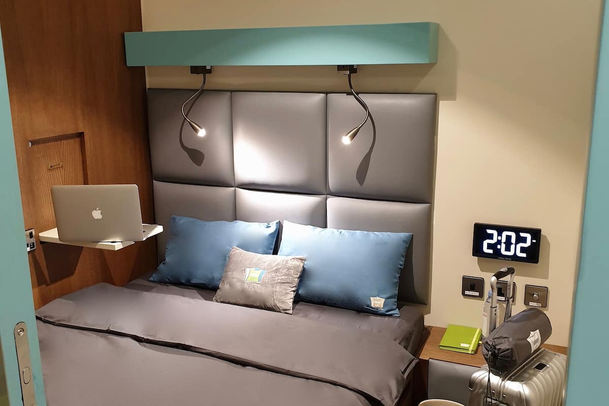 laptop workspace, bed sheets