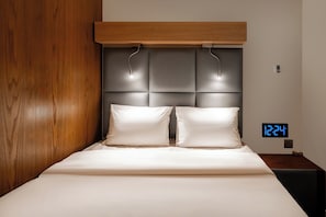 Laptop workspace, bed sheets