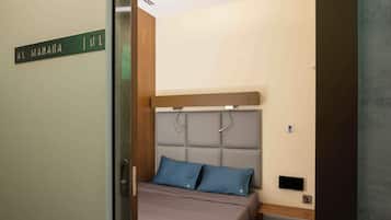 Laptop workspace, bed sheets