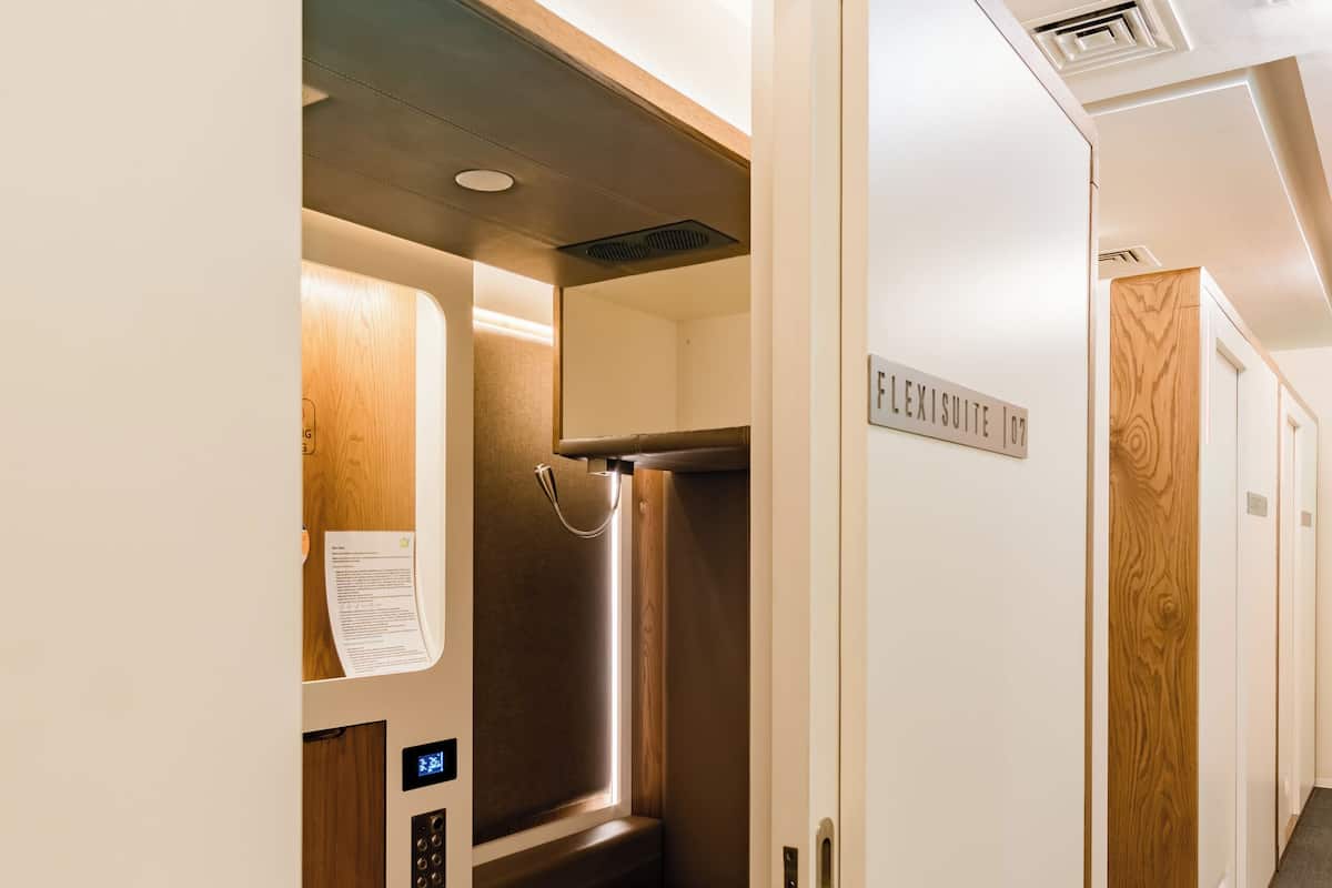 Laptop workspace, bed sheets