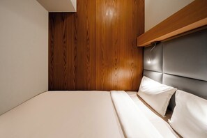 Laptop workspace, bed sheets