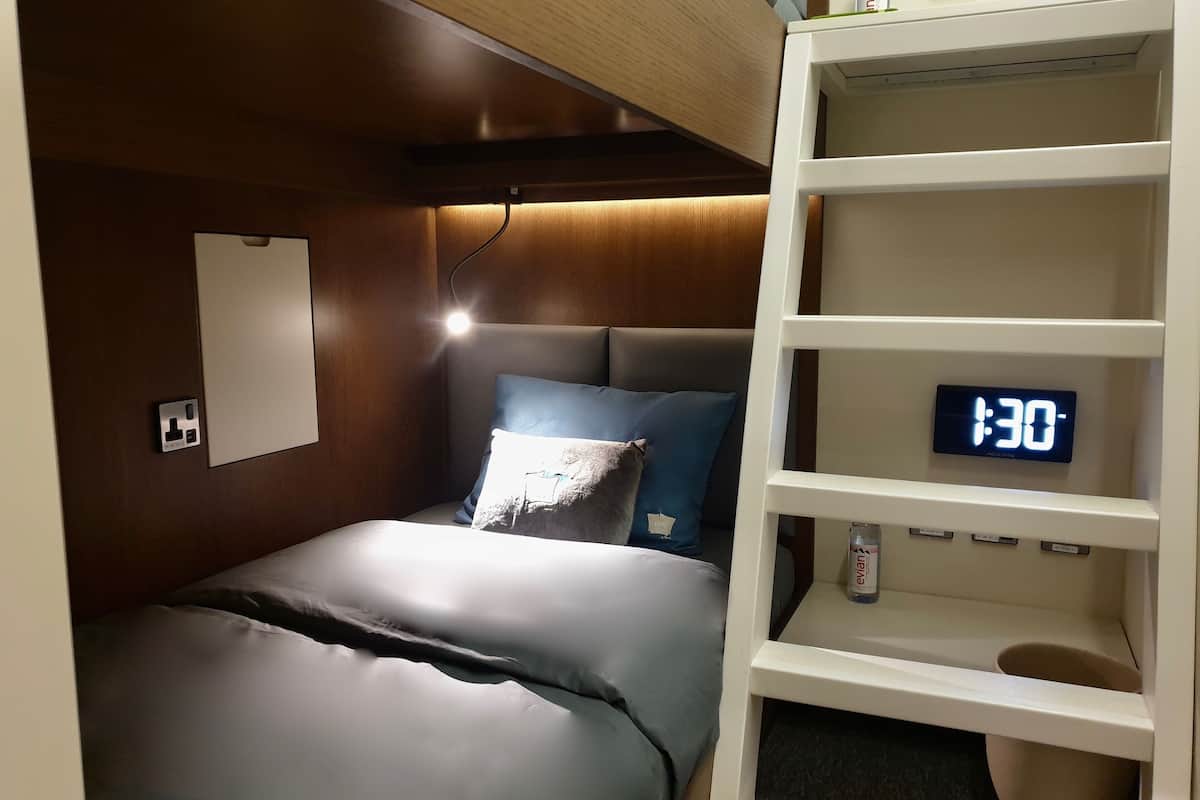 laptop workspace, bed sheets