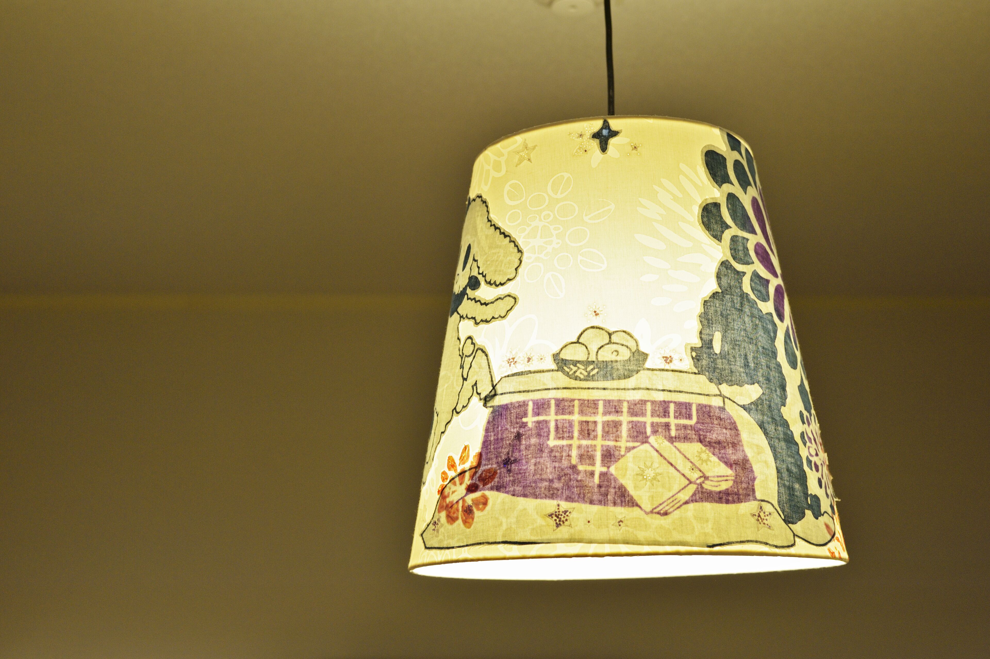 A hanging lamp with a patterned design.