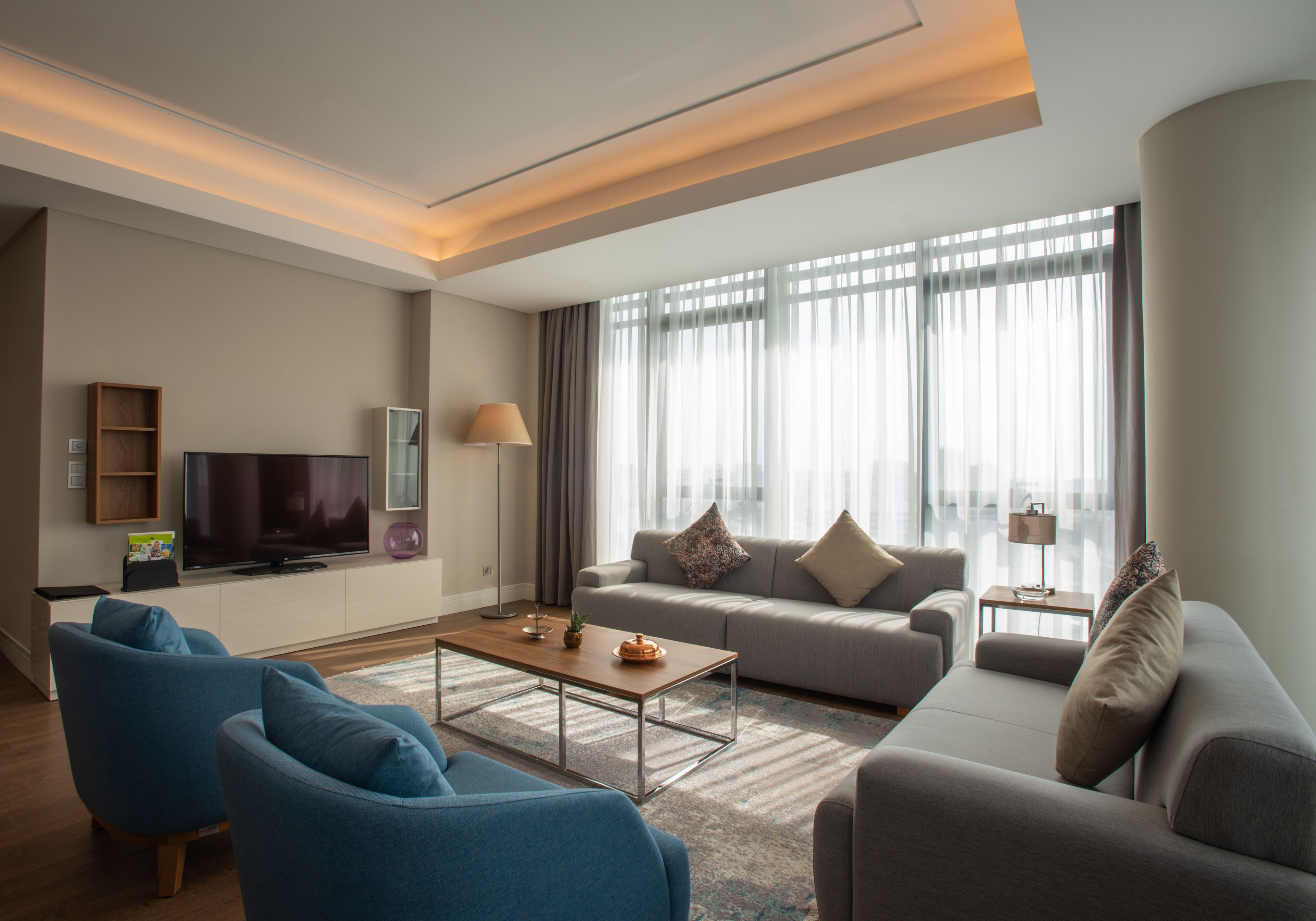 Deluxe Suite, 4 Bedrooms | Living room | LCD TV