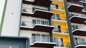 A multi-story building with balconies, some with railings and some without. - Premier Executive Apartment - The Ivy, East Legon (East Legon)