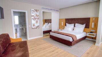 Superior Double Room, River View | Minibar, in-room safe, desk, laptop workspace