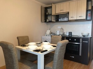 Fridge, microwave, stovetop, cookware/dishes/utensils