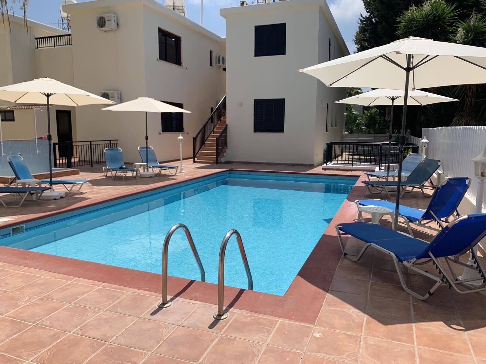 Outdoor pool, open 9:00 AM to 7:00 PM, pool umbrellas, pool loungers
