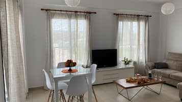 Superior Apartment, 1 Bedroom | Living area | Flat-screen TV