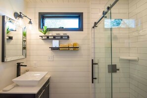 Shower, hair dryer, towels - Tiny Container Home with Rooftop Deck (Waco)