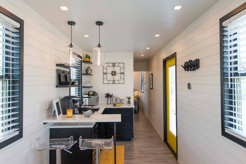 Fridge, microwave, coffee/tea maker, cookware/dishes/utensils