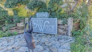 A sign for Ship Watch Villas with a date '1896' and a bird sculpture. - Amazing views of the ocean, community pool, private covered deck (North Topsail Beach)