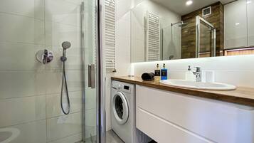 Shower, hair dryer, towels, toilet paper