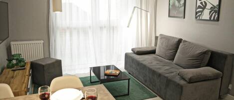 Comfort Apartment | Living area | Flat-screen TV