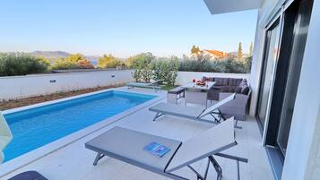 Outdoor pool, pool umbrellas, pool loungers