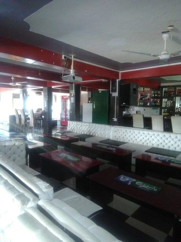 A bar area with seating and a bar counter.