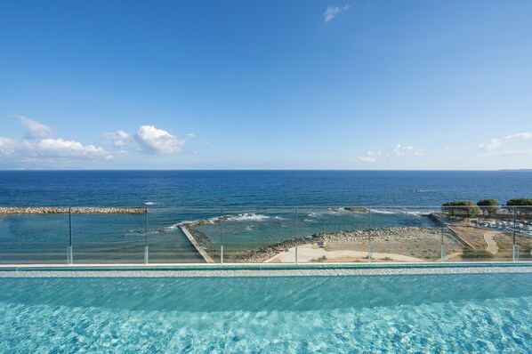 Seasonal outdoor pool, open 9:30 AM to 6:30 PM, pool umbrellas