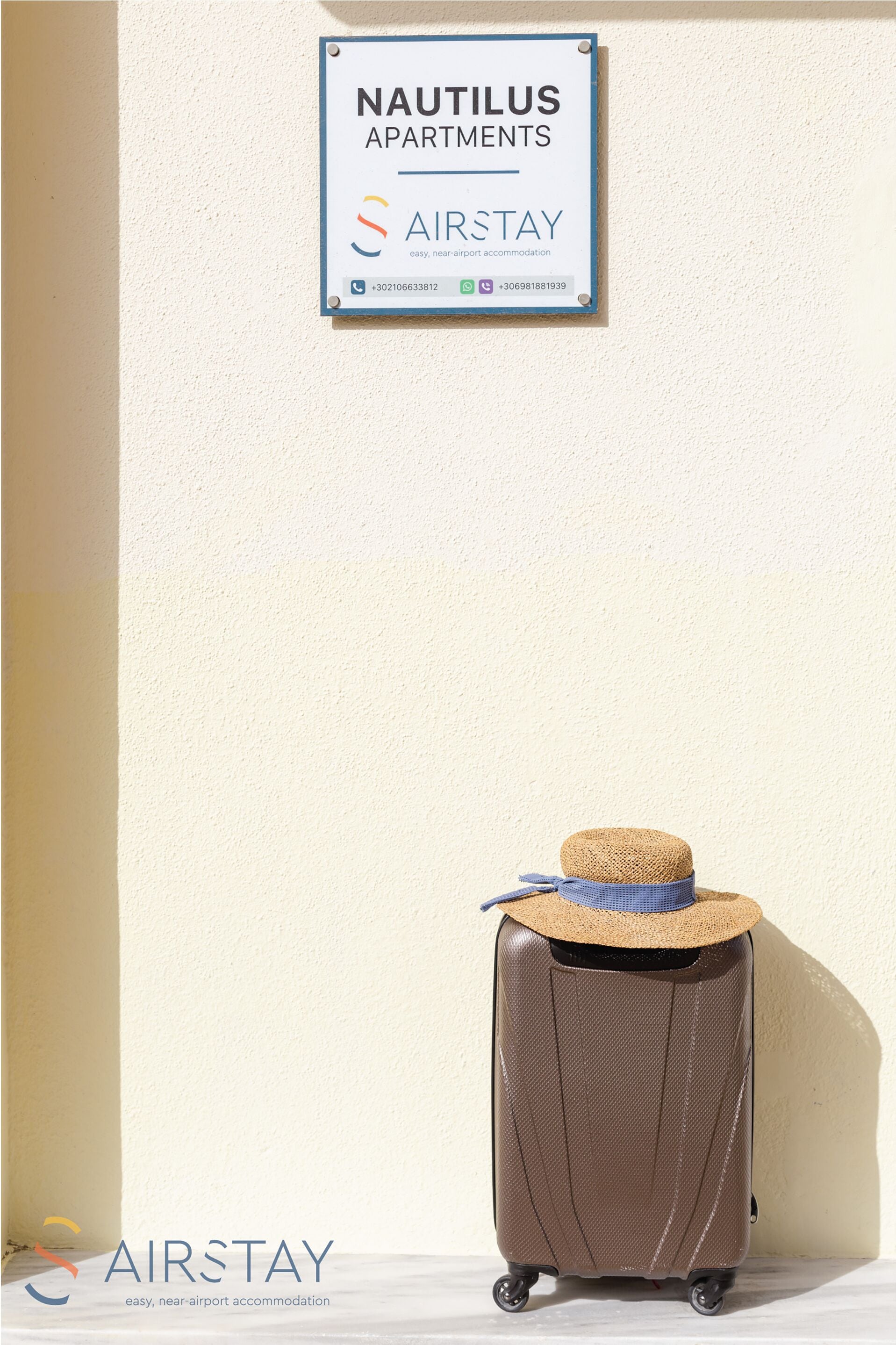 A sign for Nautilus Apartments with contact information and the AirStay logo.