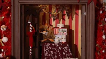 A festive display with a sign reading "Kempinski" and various holiday decorations.