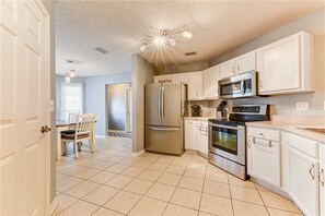 House, Multiple Beds, Private Pool, Pool View | Private kitchen | Fridge, microwave, stovetop, dishwasher - Splash Paradise, 3 Bedroom, Private Pool, Pet Friendly (Palm Coast)