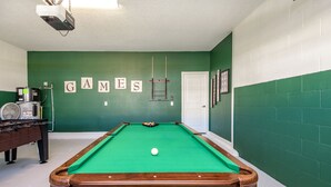 A pool table in a room with green walls and a white door. - Private Pool & Spa • Game Room • Waterpark • Golf • Gated • Near Disney (Davenport)