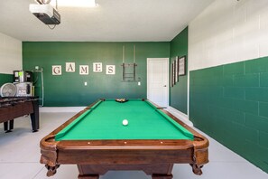 A pool table in a room with green walls and a white door. - Private Pool & Spa • Game Room • Waterpark • Golf • Gated • Near Disney (Davenport)