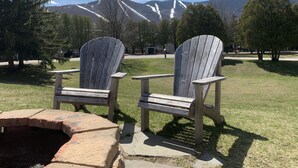 Two Adirondack chairs in a park with a mountain backdrop. - Year Round Green Mountain Escape - Ski - Swim - Tennis - Hike - Golf (Warren)