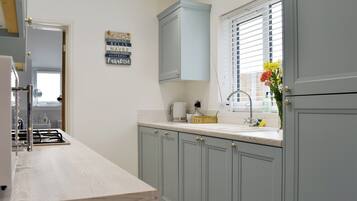 Oven, dishwasher, highchair, cookware/dishes/utensils