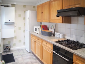 Oven, dishwasher, high chair, cookware/dishes/utensils