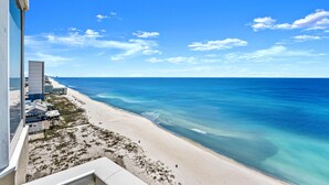 A beach view from a high-rise building with clear blue sky and ocean. - Gulf-Front 2 Bed, 2 Bath • Sleeps 8 • Amenity-Packed • Beach Chair Service for 2 (Panama City Beach)